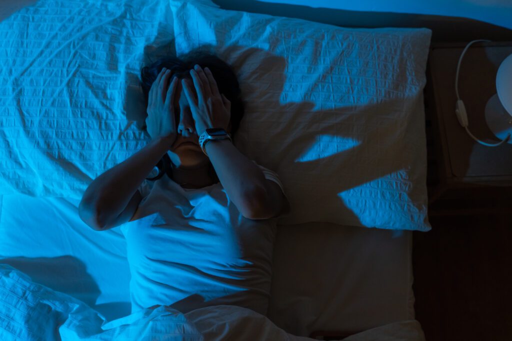 woman with insomnia in bed