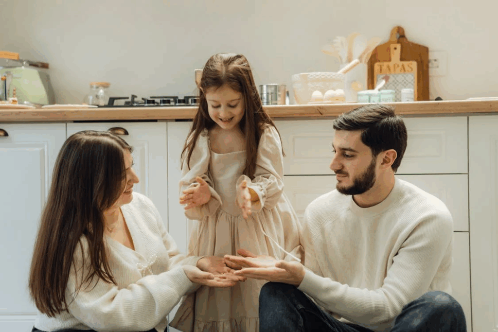Happy Family good parents Baking Together in Cozy Kitchen